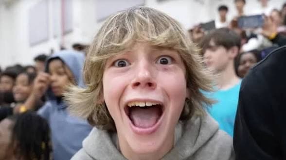 The 67 Kid at a basketball game, in the supplied meme photo